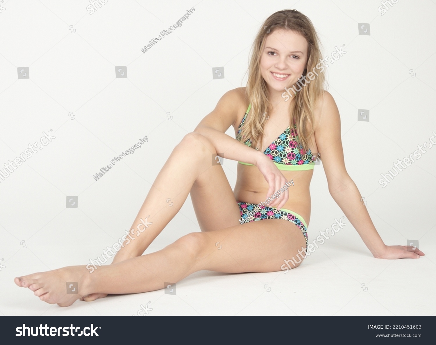 pictures of 10-year-old girls in bikinis with their legs spread
