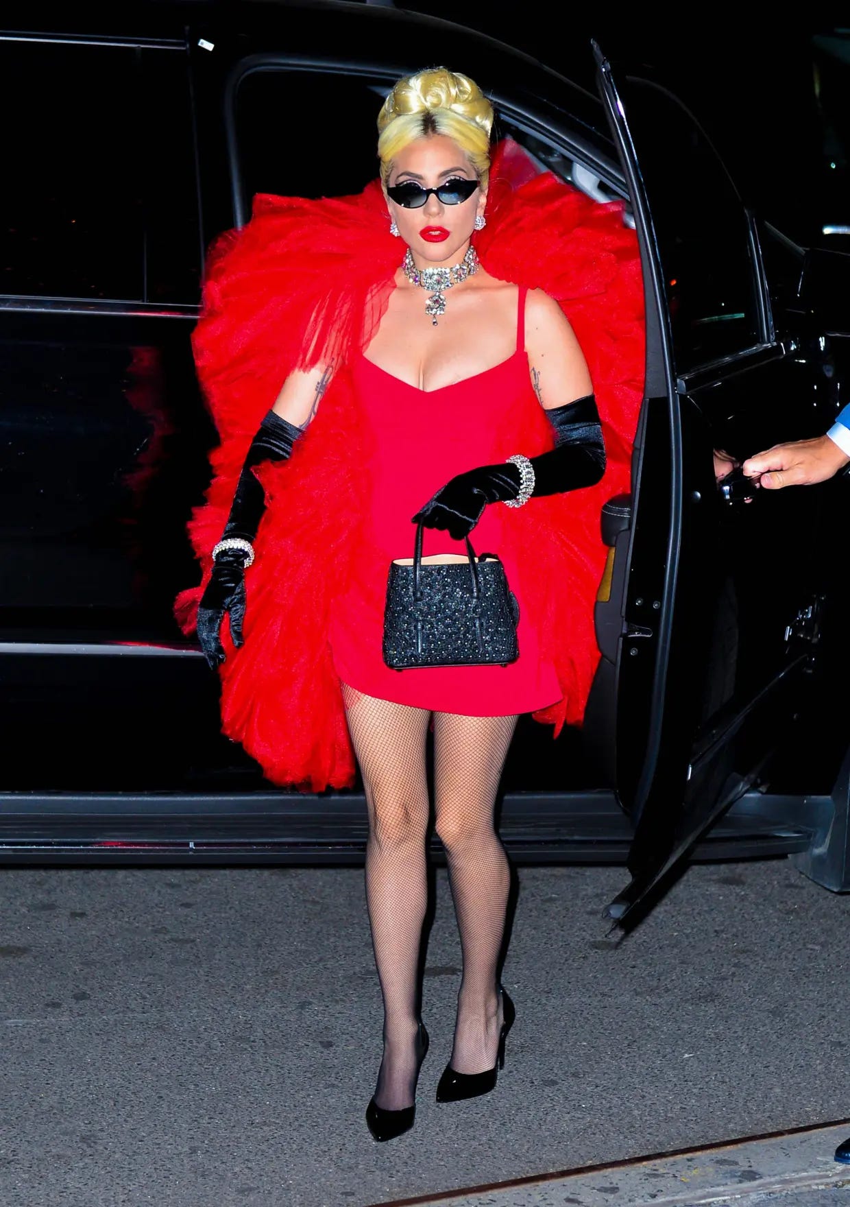 Searching for stunning Lady Gaga red outfit photos? (Find high-quality pictures from her best moments)