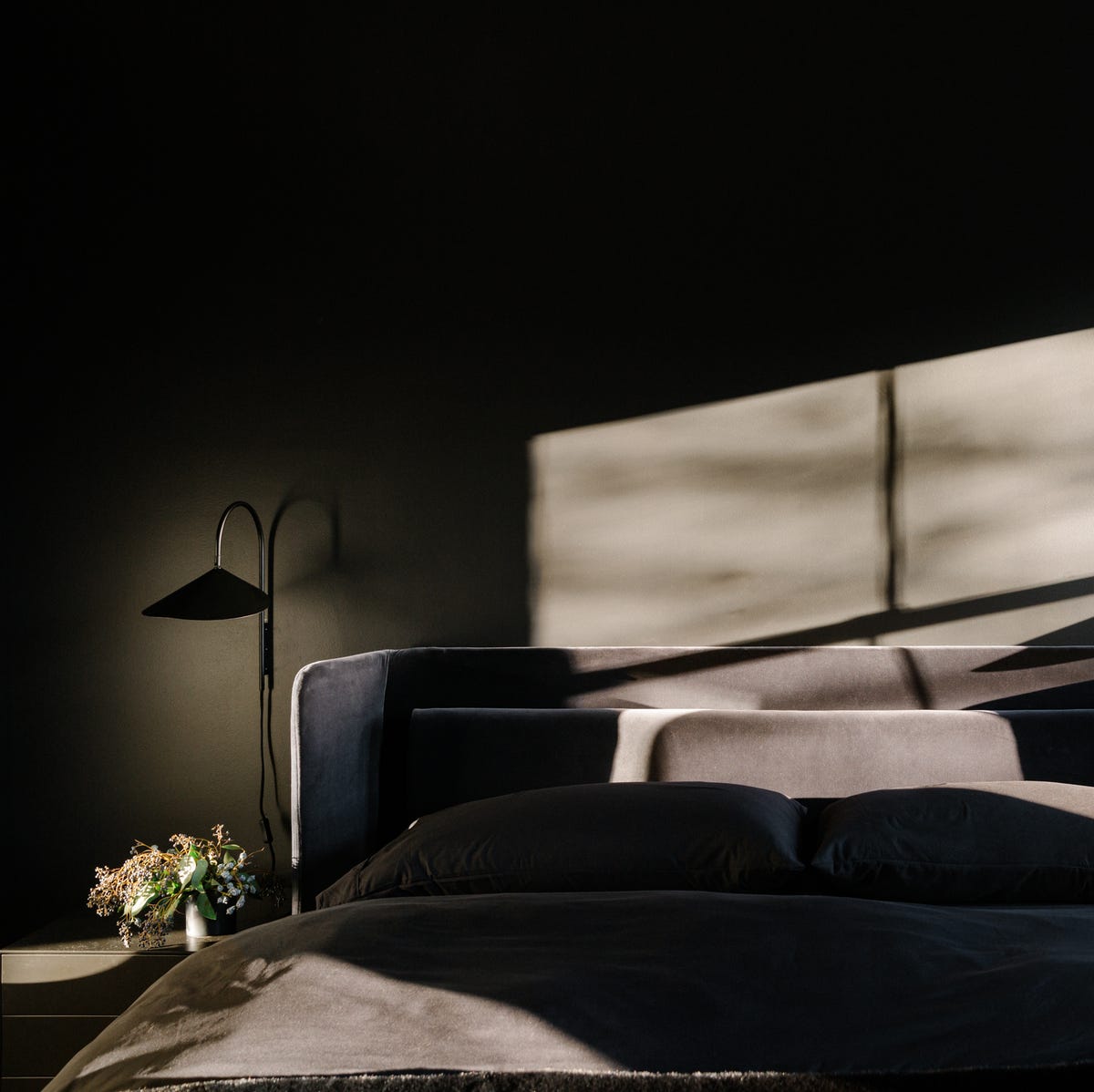 Worried mens bedroom ideas black are too dark? Learn how to make it stylish and not gloomy.