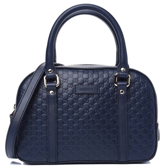 How much is a navy blue gucci purse? Get the real price & shopping tips now!
