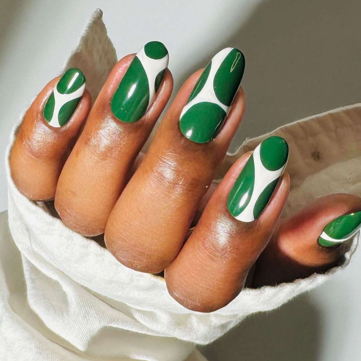 Affordable dark green nail art? Get stylish looks without high cost!